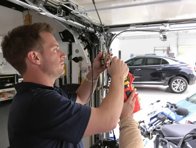 Grove City Garage Door Repair safety certified technician performing cable replacement in Grove City